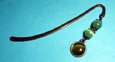 grünem Cateye Cabochon